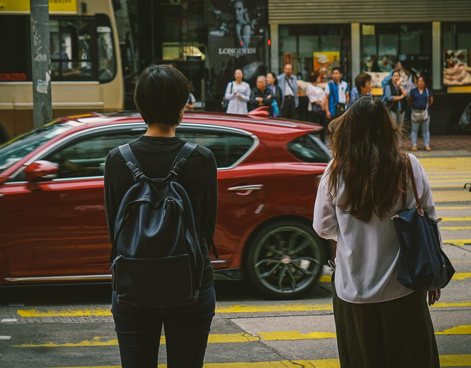 Photo of women waiting to cross a street